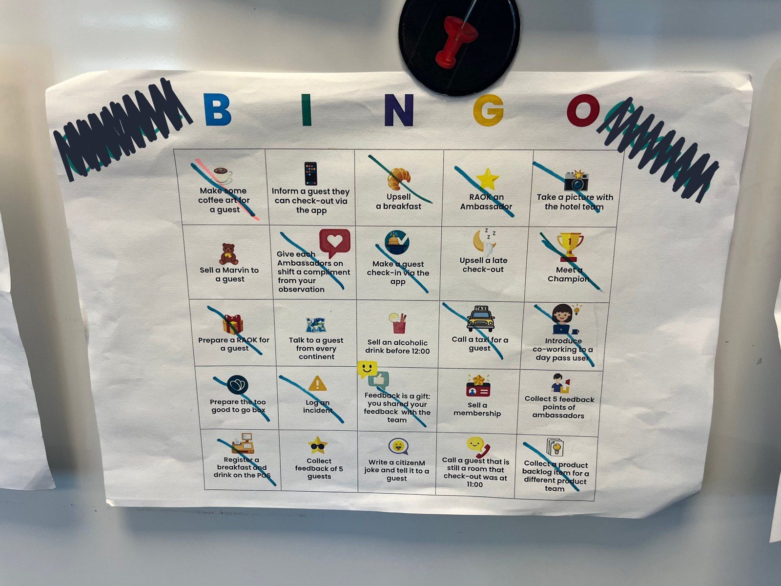 A filled-in citizenM guest bingo card, with the staff names scribbled out