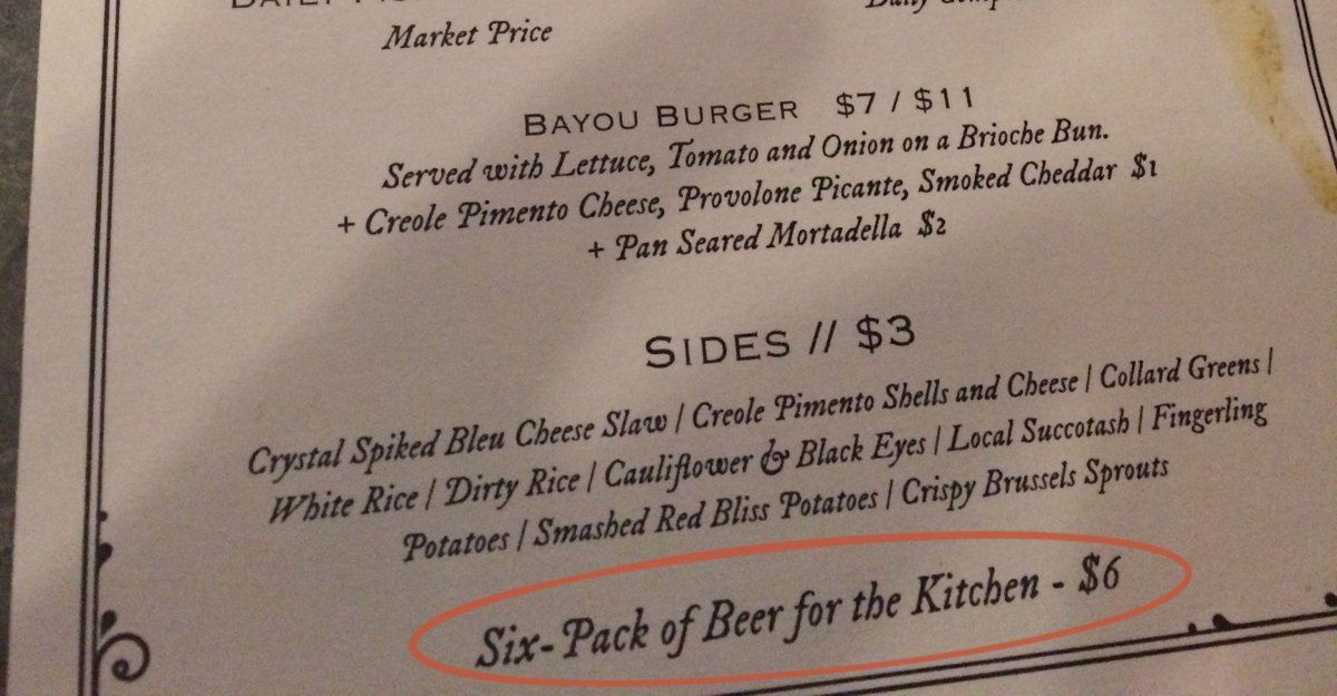 The bottom of a restaurant menu with a marker circle around the line Six-Pack of Beer for the Kitchen