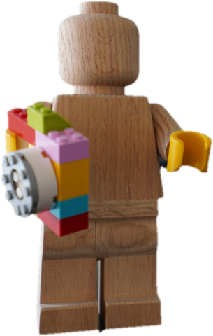 A small wooden LEGO figure.